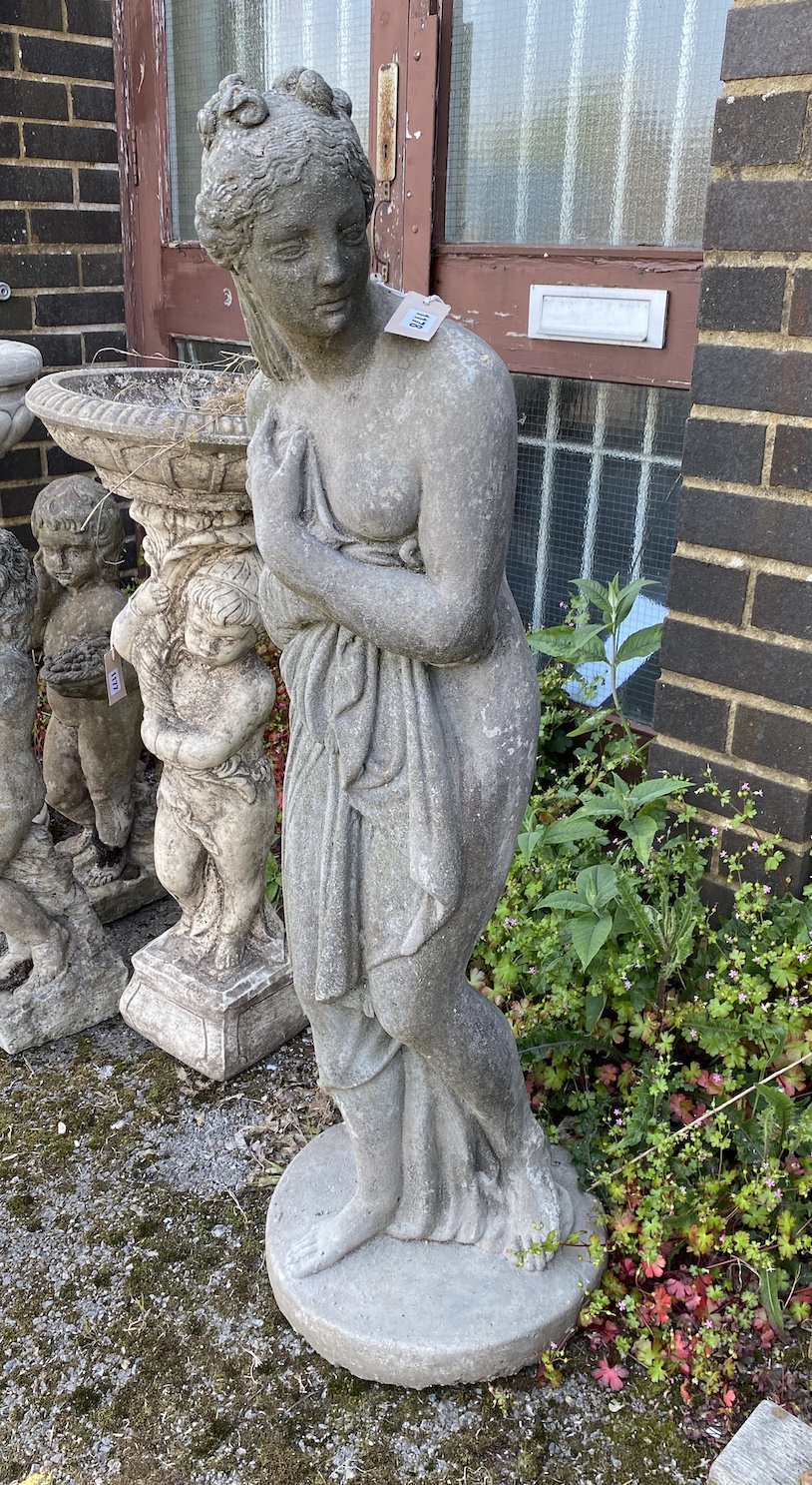 A reconstituted stone garden statue of a female bather, height 120cm